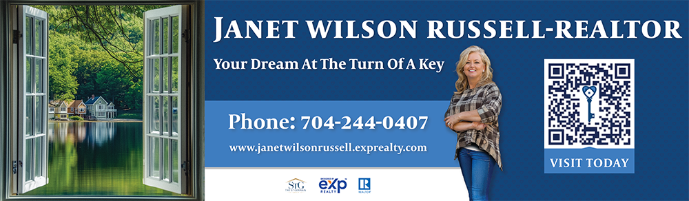 An ad for a realtor with a picture of window opening to a lake view